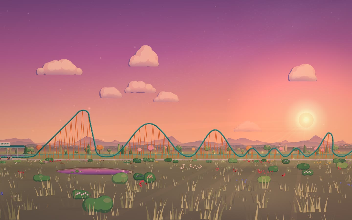 A coaster's teal track and orange supports against a pink and orange sunset.
